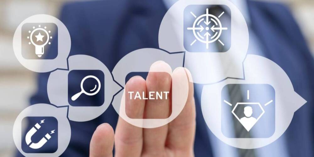 fingers pressing on window over word talent