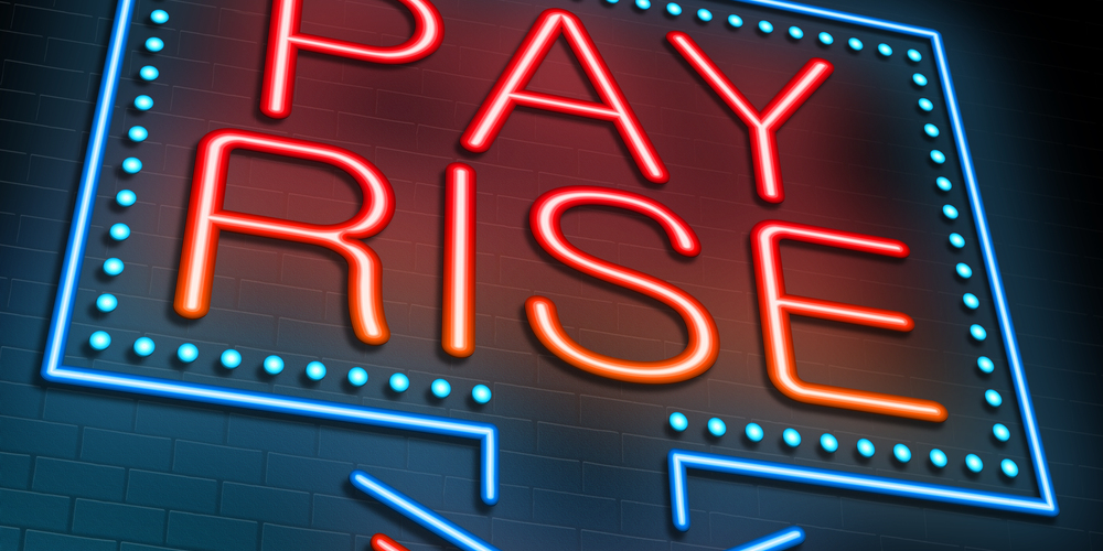 Pay Rise sign lit up in red