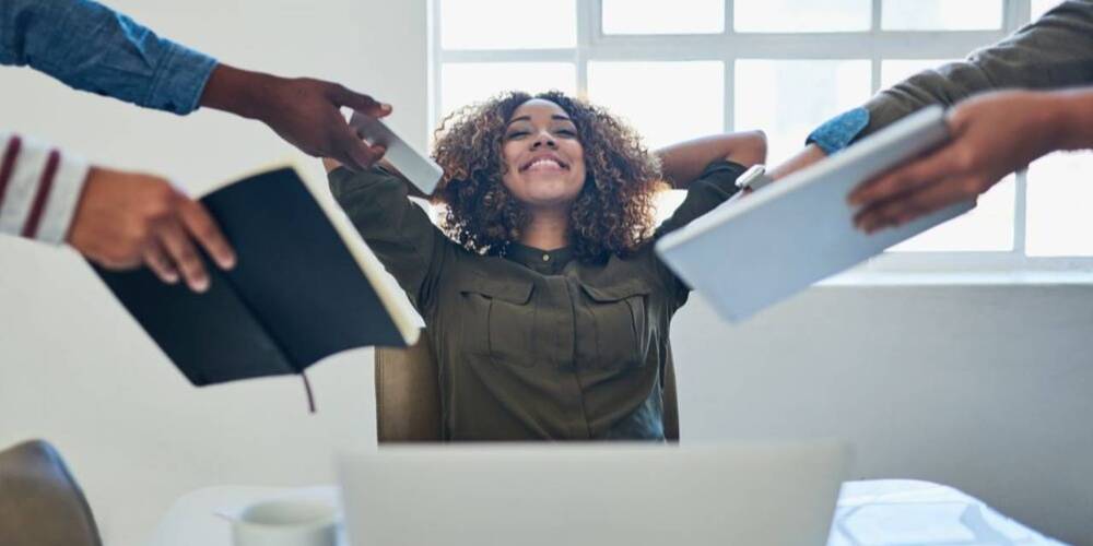Woman being given lots of work