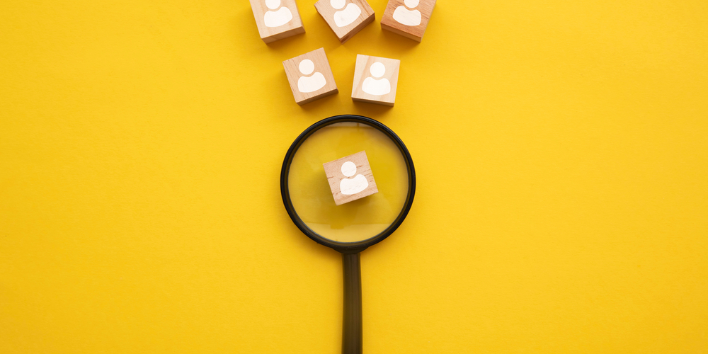 Magnifying glass highlighting person